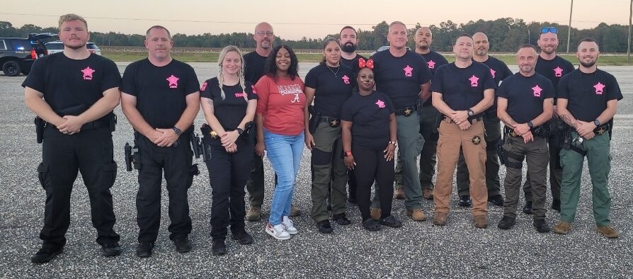 Barbour County Sheriff's Office staff wearing Cuffing Cancer shirts